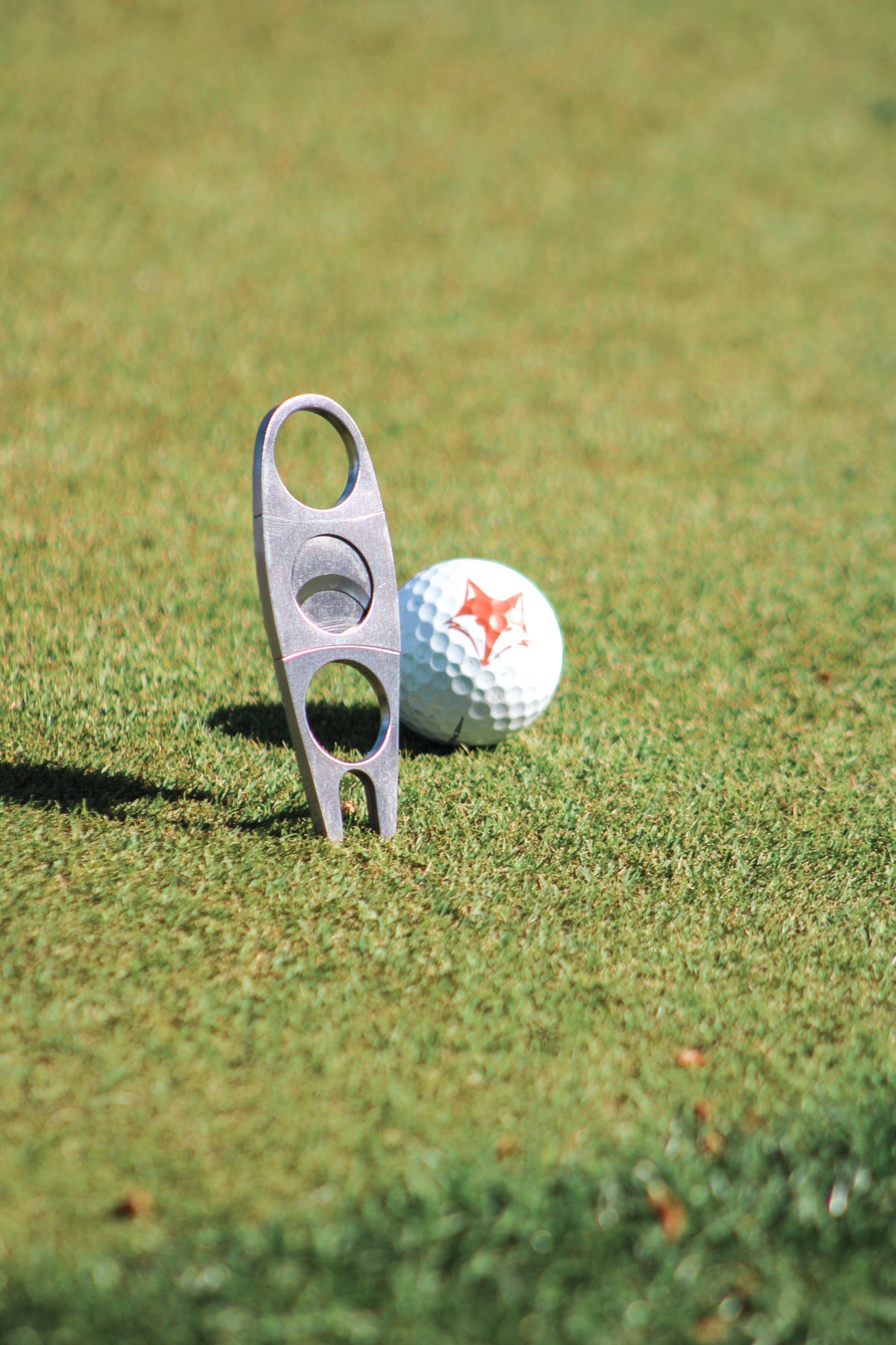 Cigar Cutter + Divot Repair Tool
